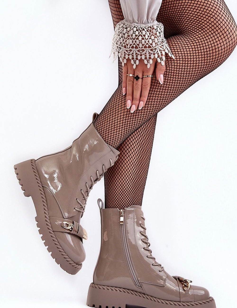 Stylish Jevira Gold-Trim Platform Boots with eco leather and gold accents, featuring a side zipper and insulated lining for warmth.