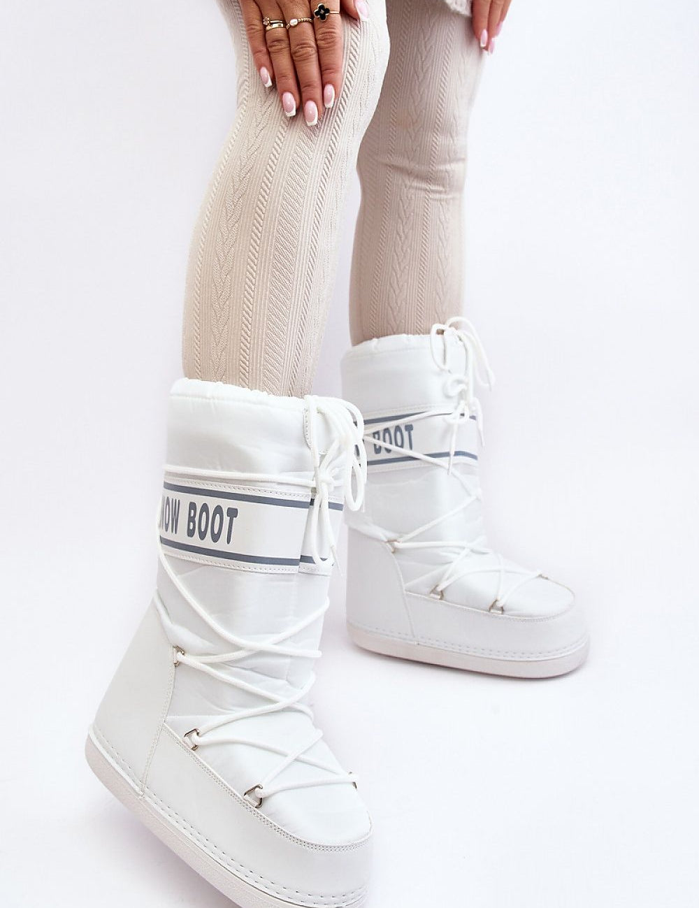 Astrella High Platform Snow Boots with eco leather detailing and cozy fleece lining, showcasing bold lettering and durable design.