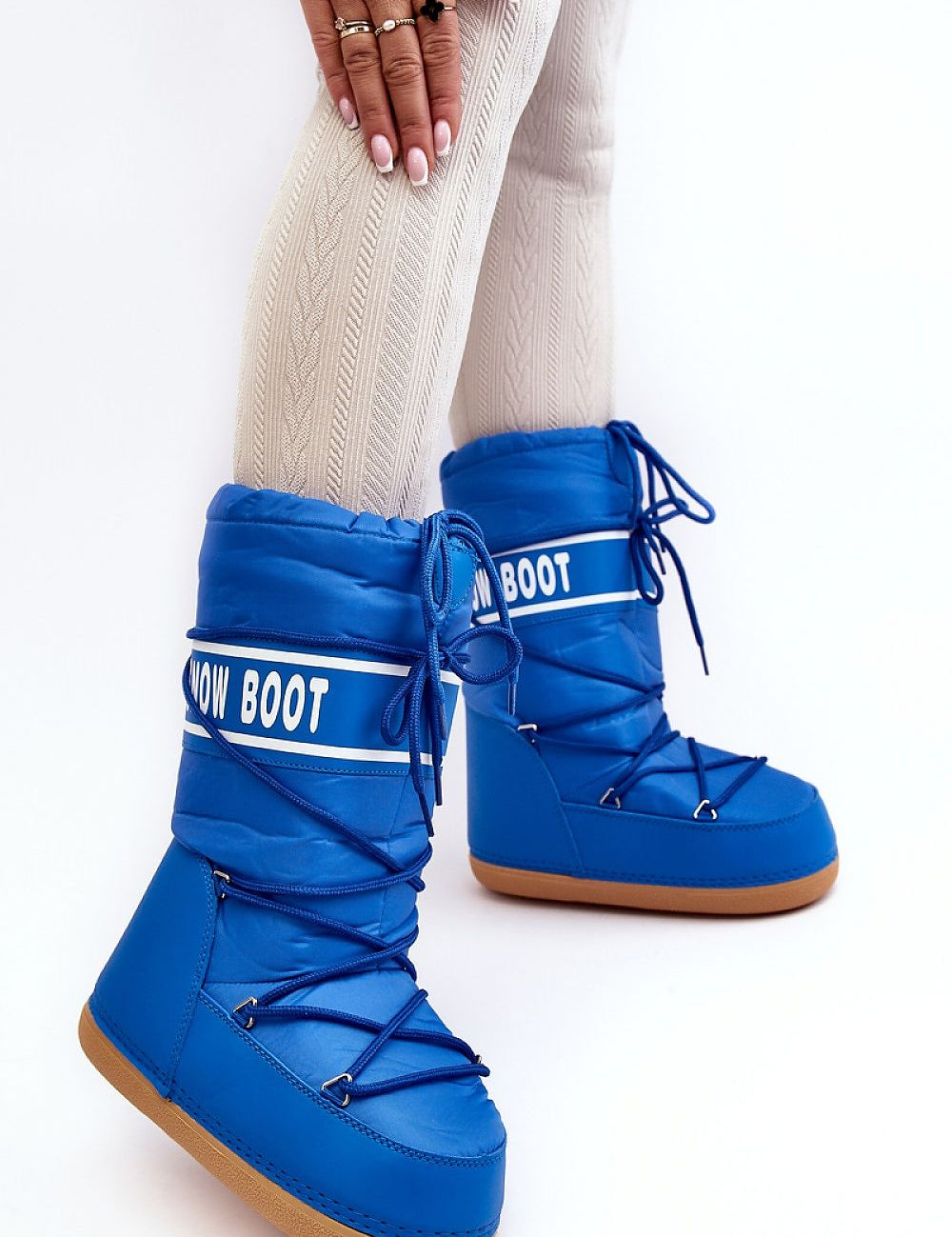Astrella High Platform Snow Boots in vibrant blue with white lettering, featuring dual lacing and thick soles for warmth and grip.
