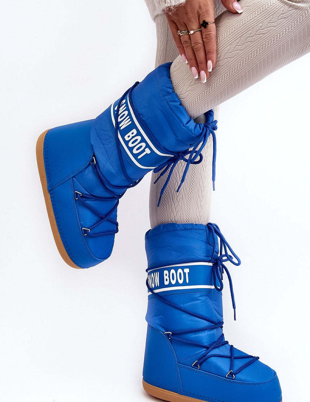 Astrella High Platform Snow Boots in blue with eco leather and bold lettering, featuring dual lacing and thick platform for grip.