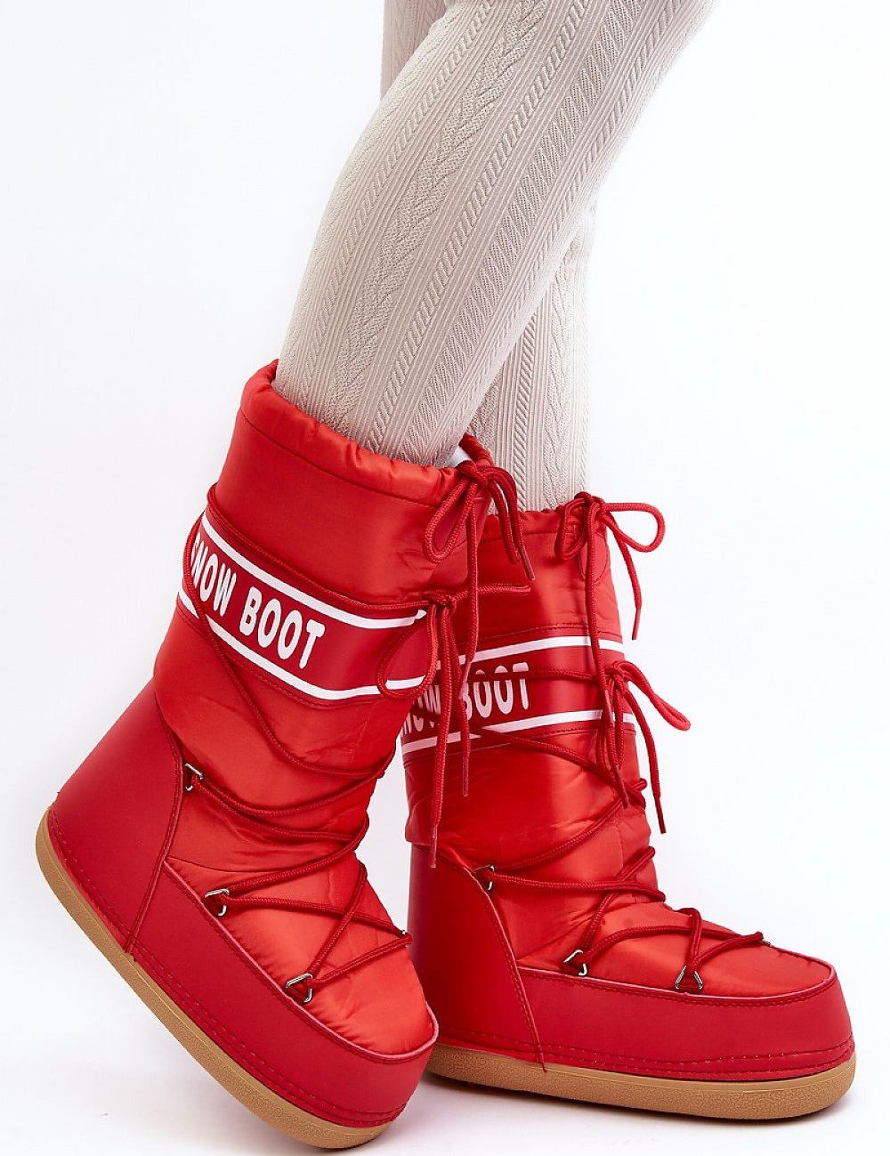 Red Astrella High Platform Snow Boots with eco leather and bold lettering, featuring dual lacing and cozy fleece-lined inner for warmth.