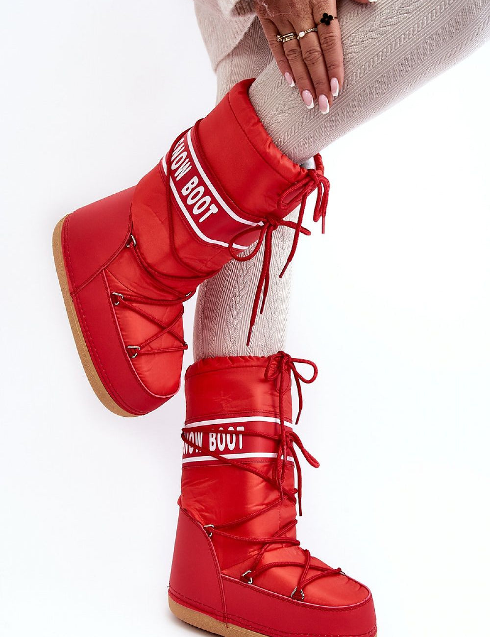 Red Astrella High Platform Snow Boots with dual lacing and eco leather details, featuring cozy fleece lining and bold lettering design.