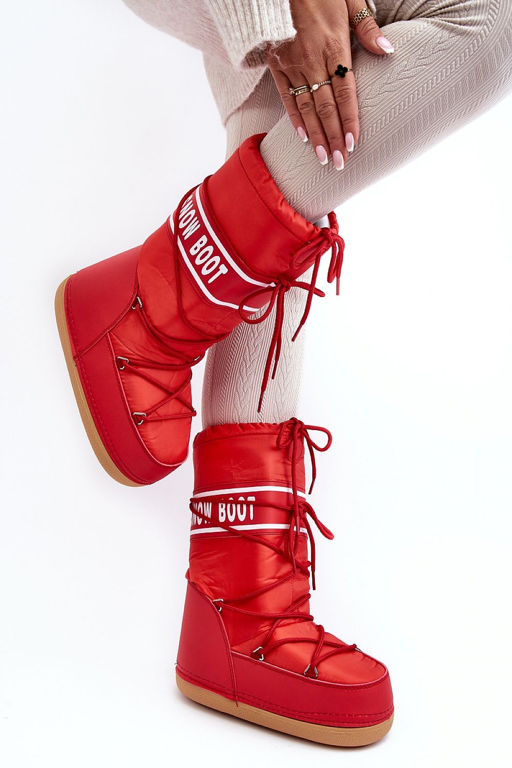 Red Astrella High Platform Snow Boots with dual lacing and eco leather details, featuring cozy fleece lining and bold lettering design.