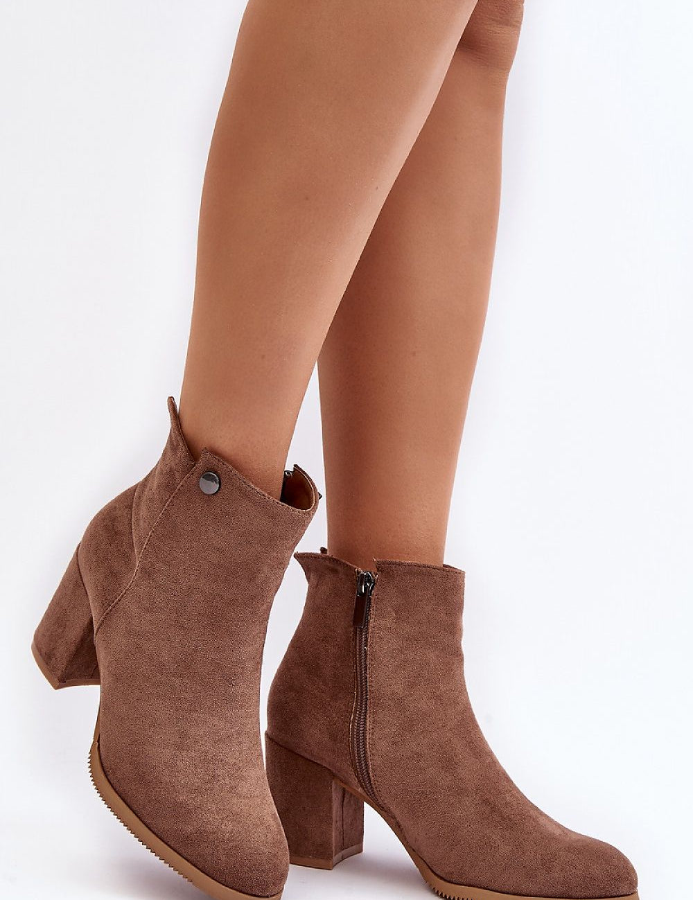 Brown eco suede ankle boots with zipper and chunky heel, featuring a rounded toe and warm lining, showcasing elegant style and comfort.