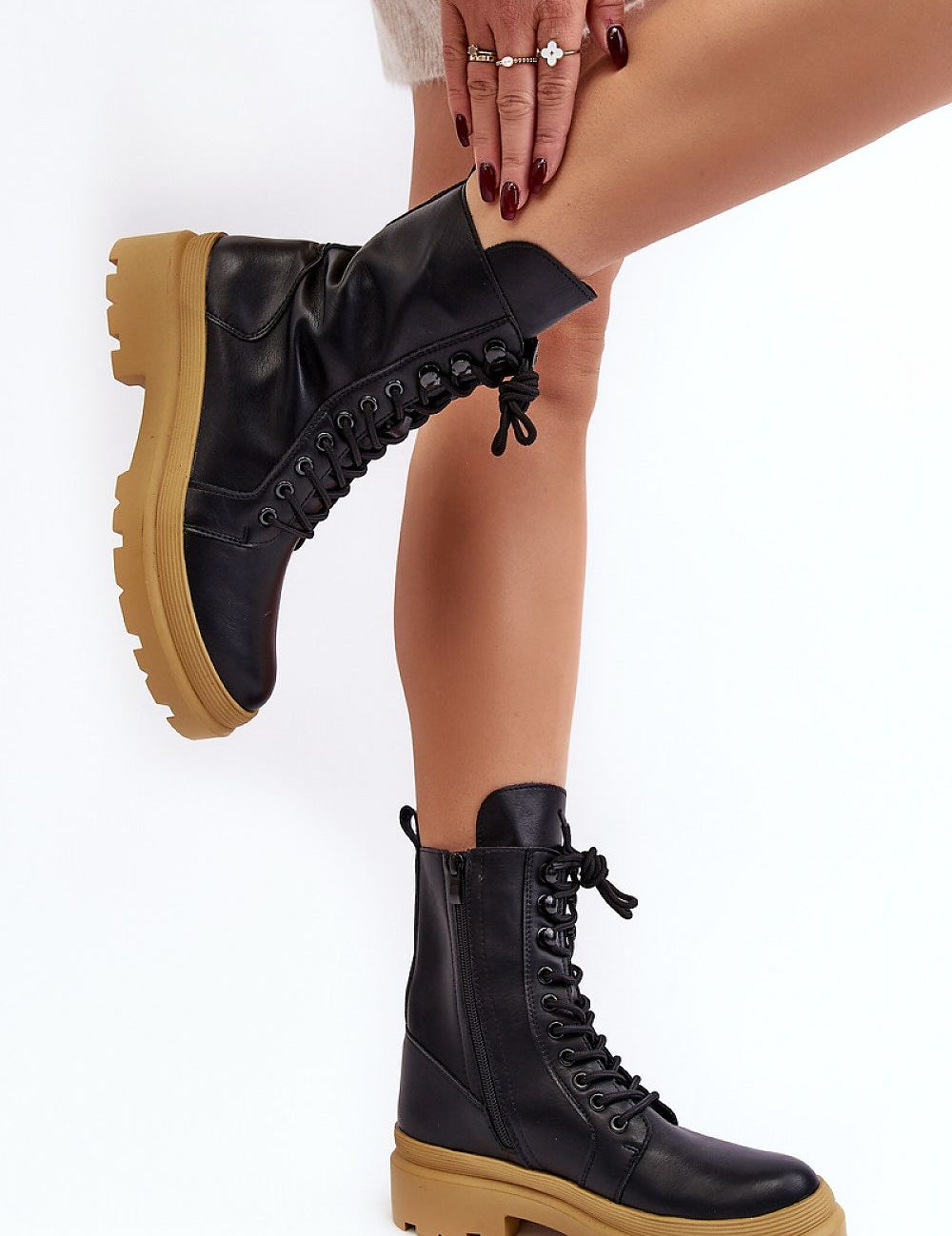 Black ankle boots with thick yellow platform, side zipper, and front lacing, perfect for autumn transitions made of eco leather.