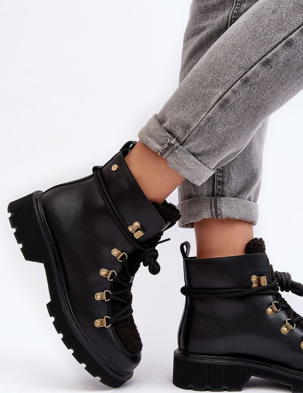 Larkwood Leather Winter Trapper Boots with lace-up design and reinforced heel, shown on model with folded jeans.