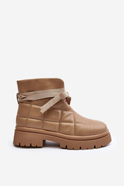 Velda quilted slip-on winter boots in tan eco leather with plush lining, flat heel, and platform sole for warm, stylish winter wear.