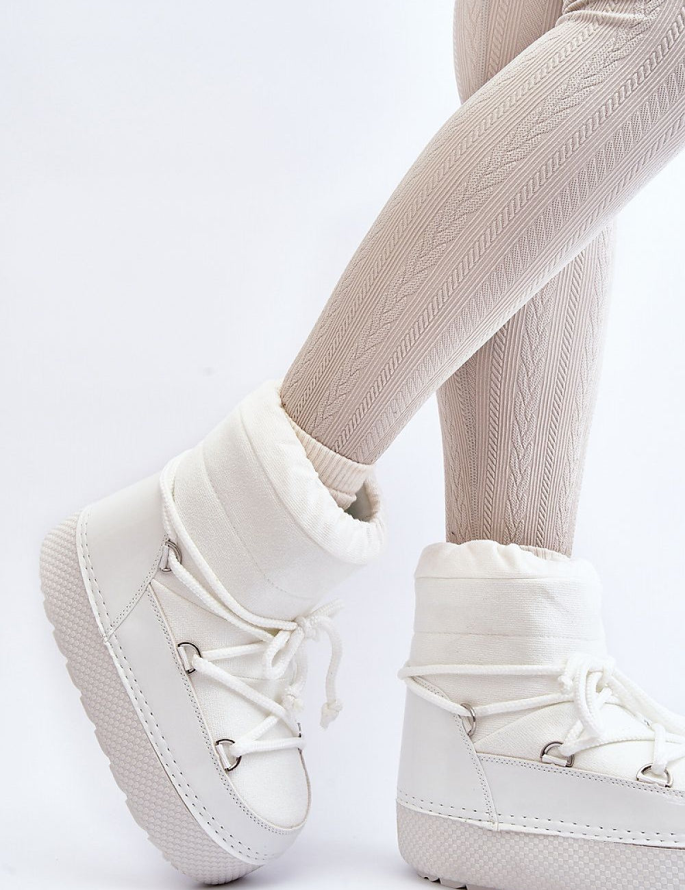 Women's white platform snow boots with laces, featuring a cozy, plush interior and eco-leather exterior for winter protection.