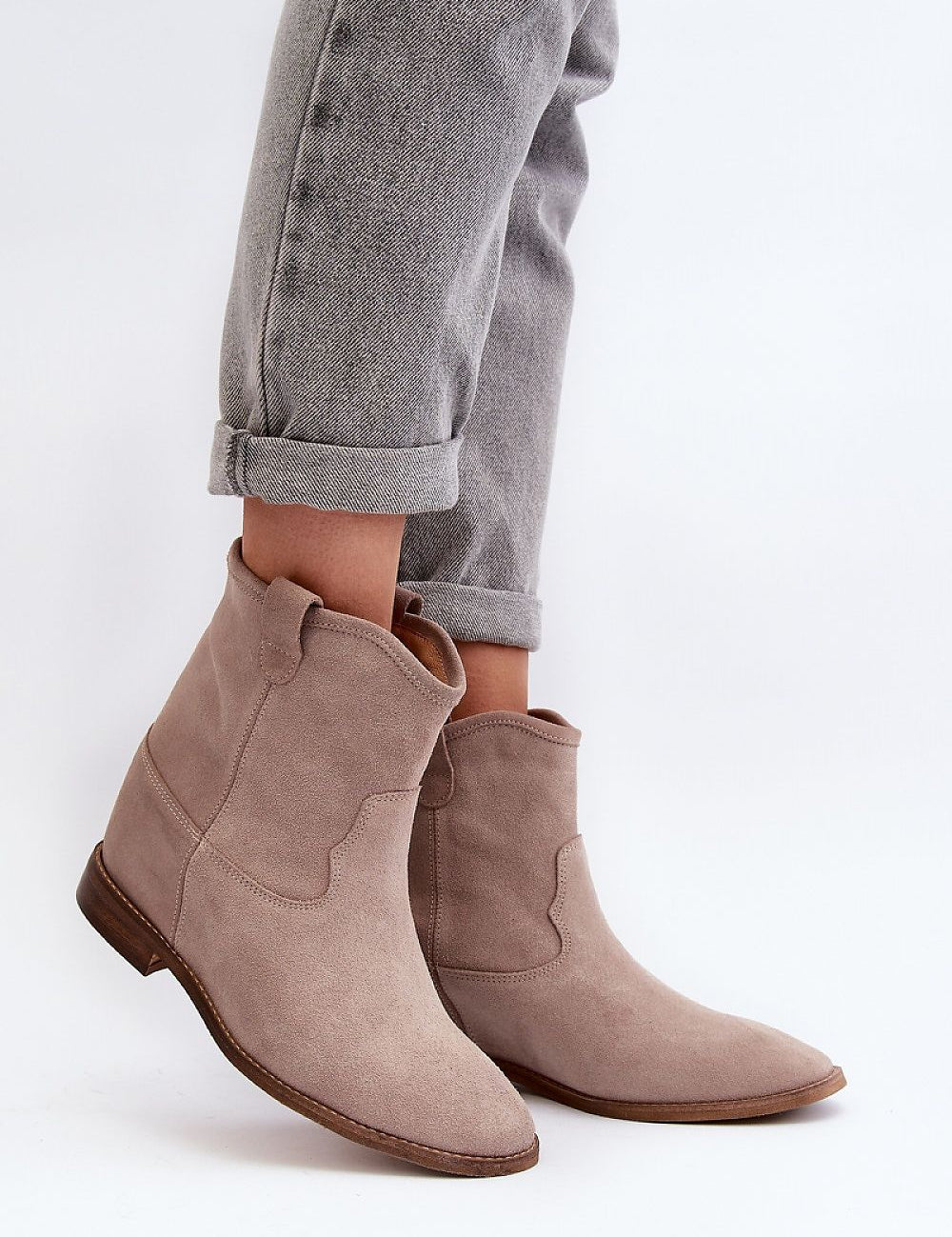 Meredia suede slip-on flat boots with concealed wedge and rounded toe, perfect for casual or minimalist outfits.