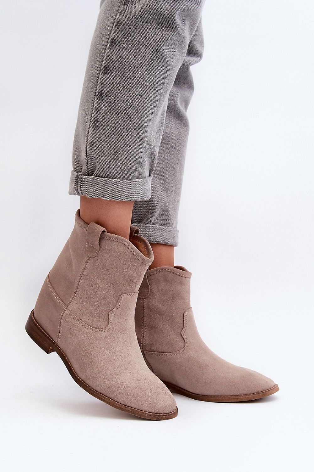 Meredia suede slip-on flat boots with concealed wedge and rounded toe, perfect for casual or minimalist outfits.