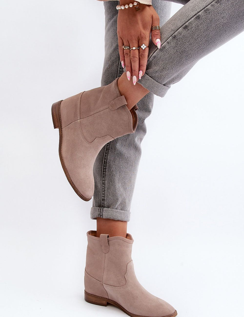 Meredia suede slip-on flat boots with concealed wedge, worn with jeans. Casual and chic footwear for everyday comfort and style.