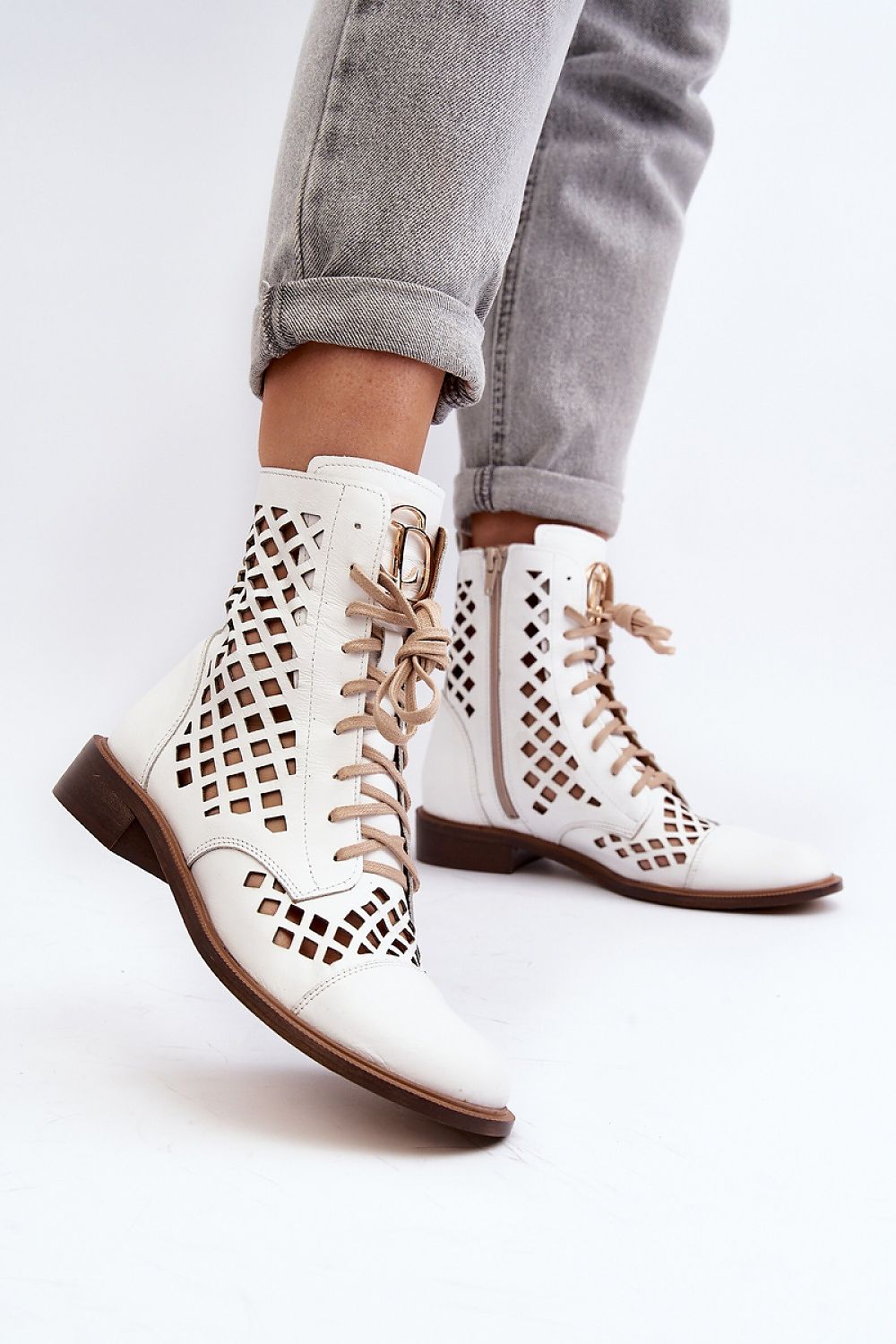 Solvitta perforated leather boots with lace-up and zipper, showcasing elegance and comfort in natural leather, perfect for seasonal wear.
