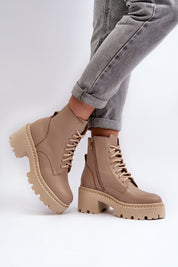 Ravnezza Chunky Leather Lace-Up Boots with block heel and thick sole in brown, worn with rolled-up jeans.