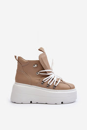 Side view of Ermelle Sculpted Platform Sneakers in tan leather, featuring a bold white sole and lace-up style for modern spring outfits.