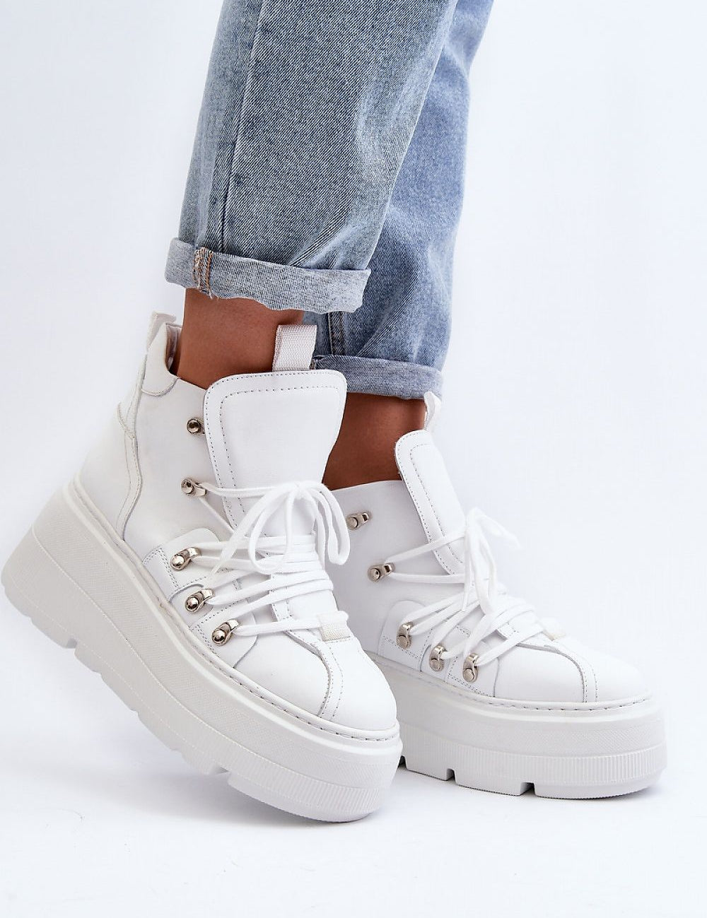 White Ermelle Sculpted Platform Sneakers with laces, genuine leather, high upper, and bold platform, paired with light blue jeans.