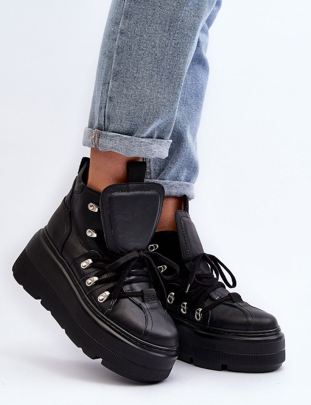 Ermelle Sculpted Platform Sneakers in black leather, featuring bold platform, rounded toe, and high upper for stability and comfort.