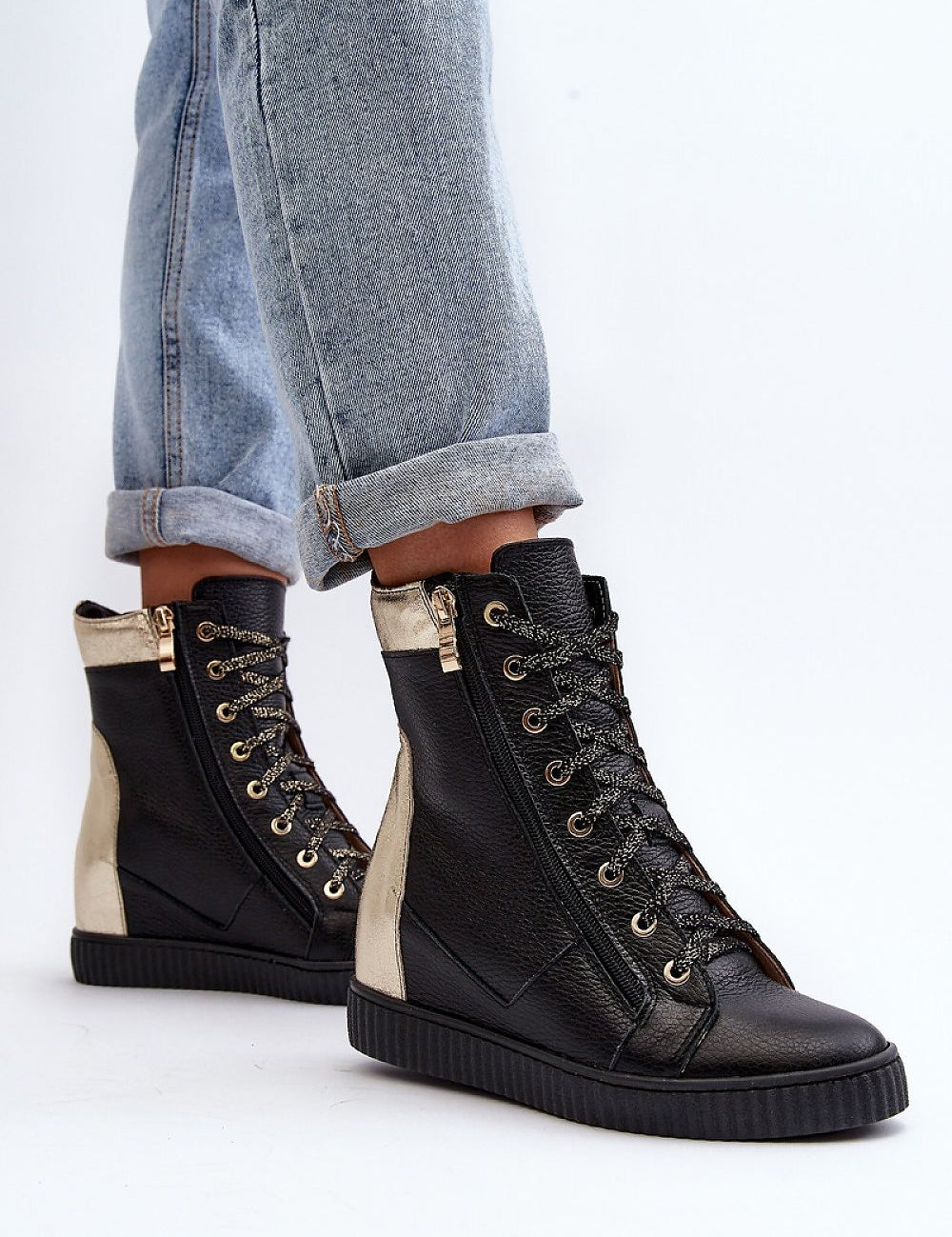 Revina Hidden Wedge Leather Sneakers with zippers and laces, modern design, shown with rolled-up jeans, ideal for spring fashion.
