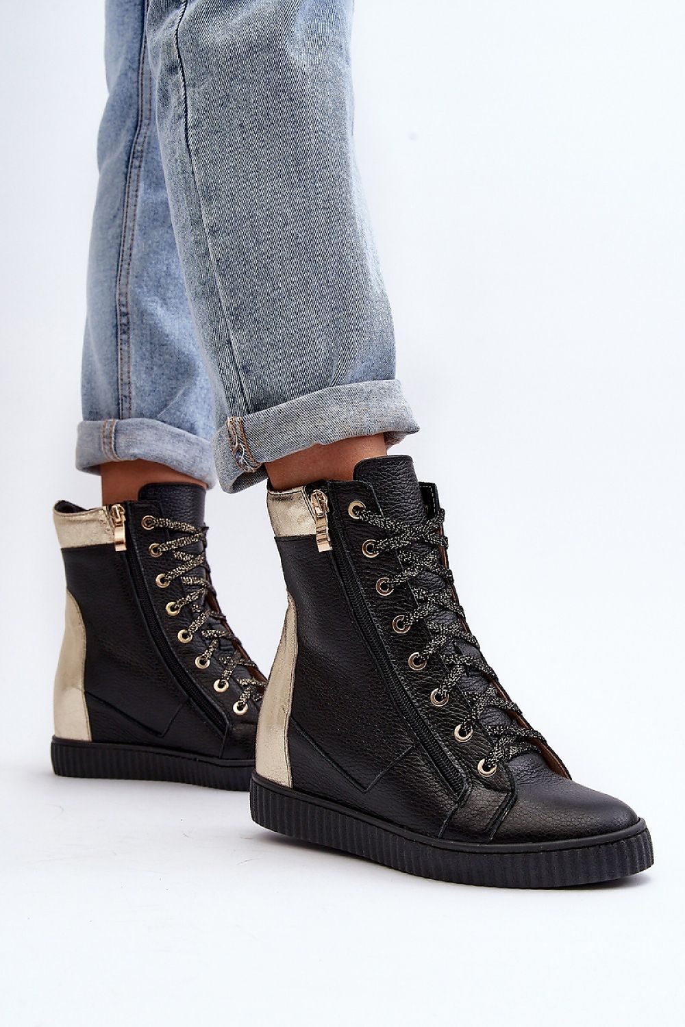 Revina Hidden Wedge Leather Sneakers with zippers and laces, modern design, shown with rolled-up jeans, ideal for spring fashion.