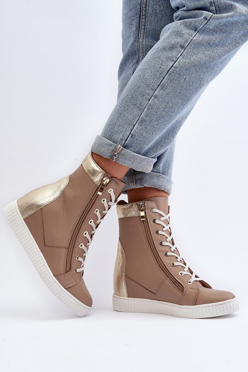 Revina Hidden Wedge Leather Sneakers with zippers and laces, modern beige design, ankle-high, worn with rolled jeans, side view close-up