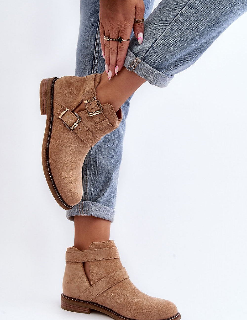 Velonna suede buckled spring boots with ankle straps, eco-suede material, flat heel, shown on model wearing denim jeans.