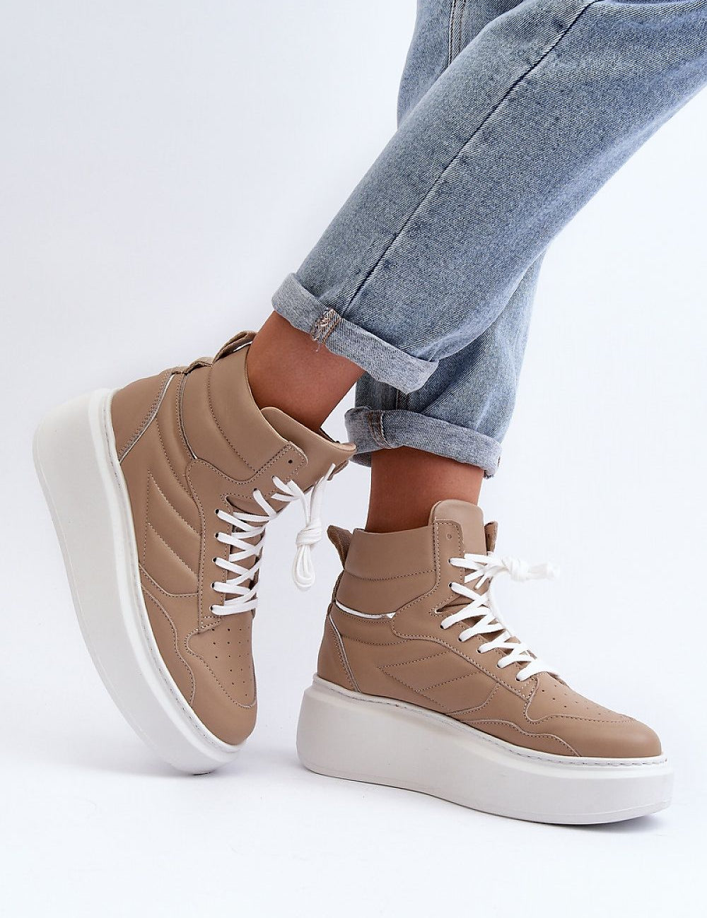 Person wearing Valonne Leather Platform Trainers with 7 cm heel, showcasing natural leather upper and thick platform base.