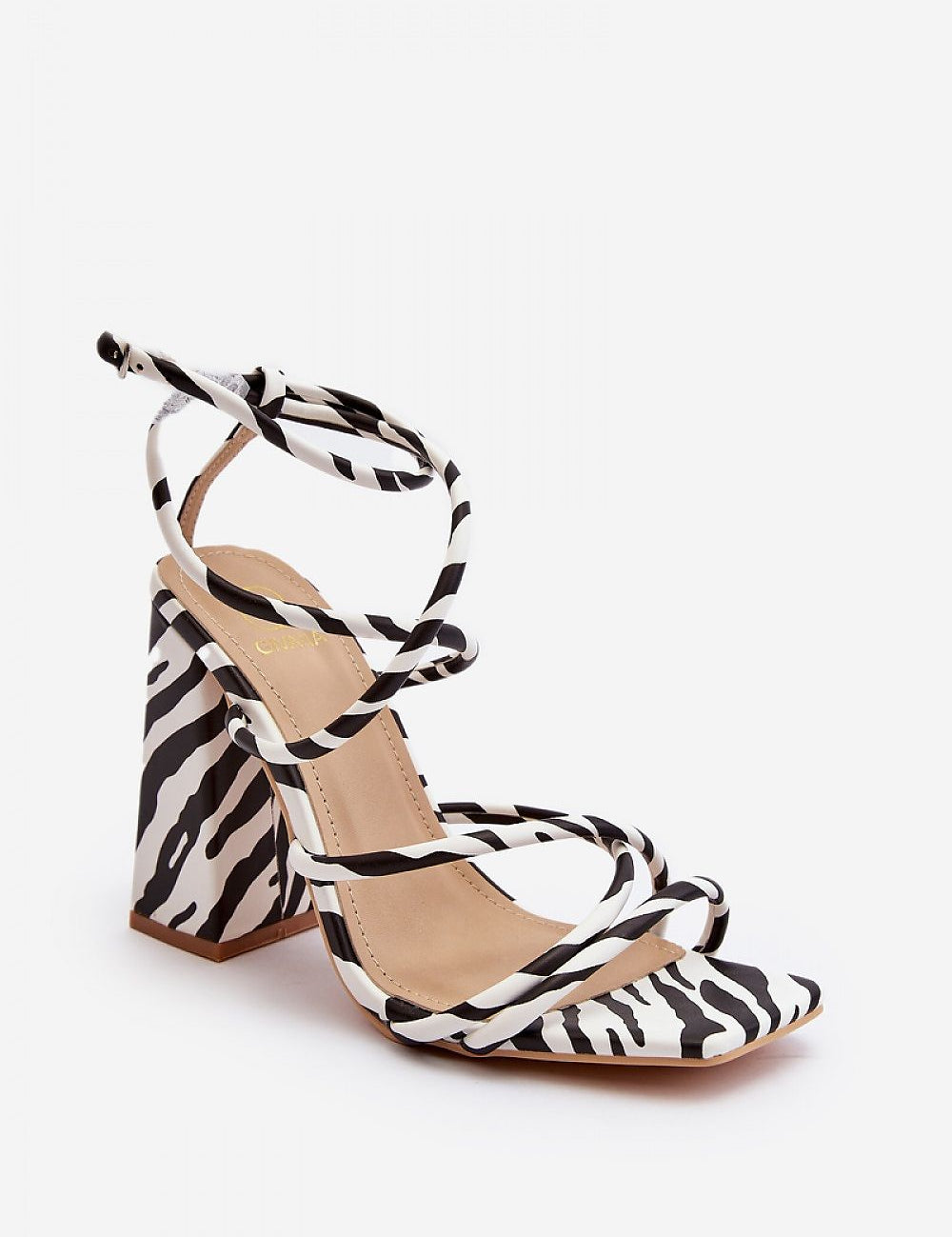 Eliore High Heel Buckled Sandals in zebra print with open design and adjustable ankle strap, featuring a sculptural wide post heel.