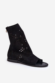 Avelynna suede openwork zip sandals in black with intricate detailing and flat heel, perfect for casual and dressier occasions.