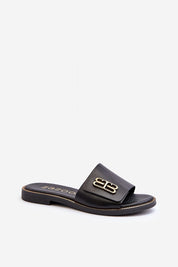 Tavirelle gold trim leather slide, featuring a sleek black design with a low-profile heel and elegant gold accent.