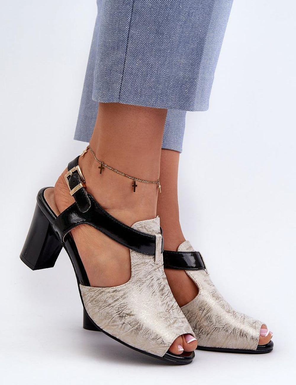 Woman wearing Esmira Post Heel Strap Sandals in eco leather, featuring adjustable buckle and cushioned insole for comfort.