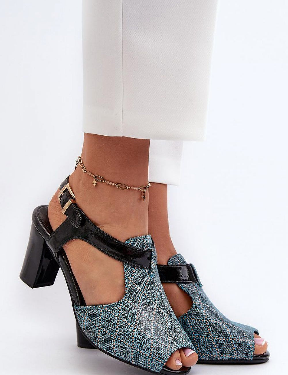 Carelia Buckled Post Heel Sandals in eco leather with adjustable strap and soft insole, offering stable elegance for warm-weather wear.