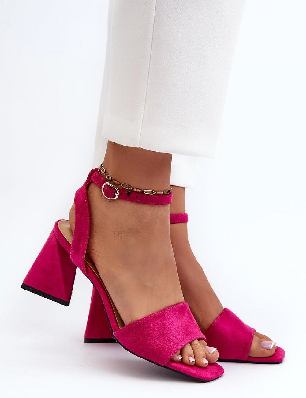 Person wearing Solavine High Suede Strap Sandals in pink with adjustable ankle straps and block heels, showing elegant design.