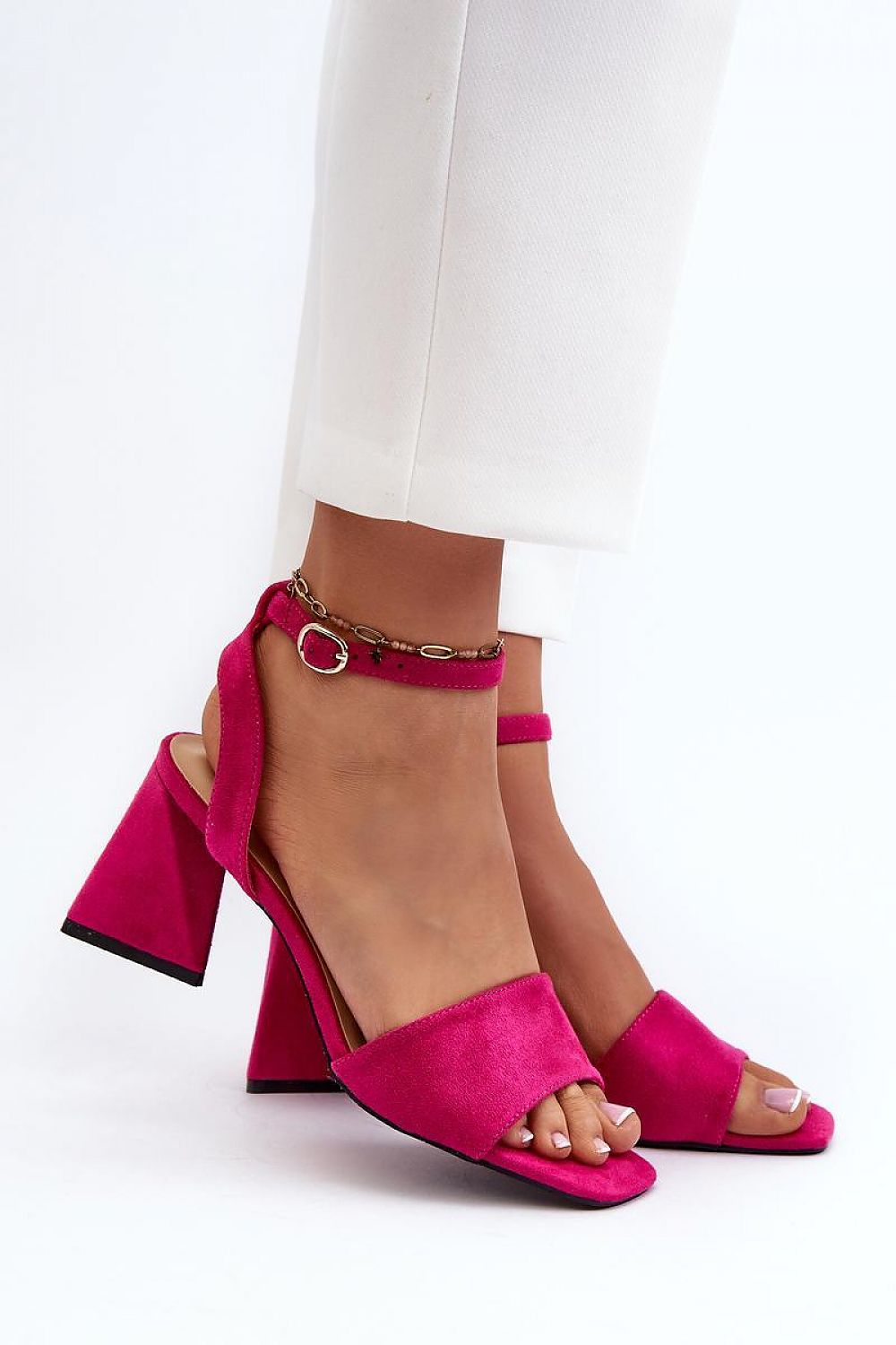 Person wearing Solavine High Suede Strap Sandals in pink with adjustable ankle straps and block heels, showing elegant design.