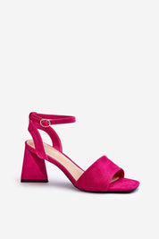 Fuchsia Solavine High Suede Strap Sandals with block heel and adjustable ankle strap, offering elegant height for warm-weather events.