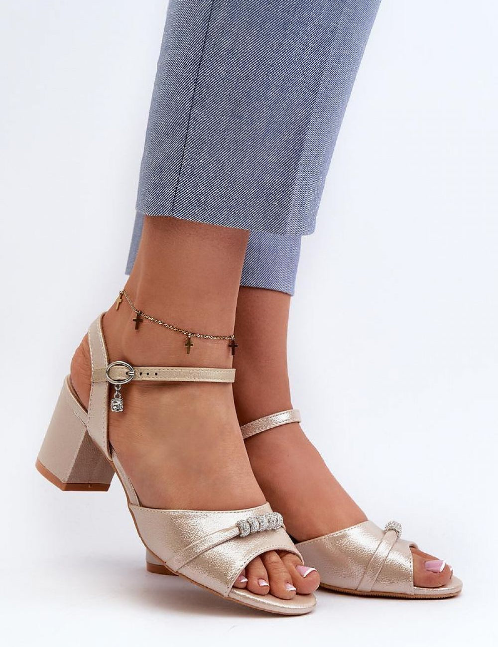 Woman wearing Avenari Soft Suede Embellished Sandals with post heels, featuring velvety eco-suede and minimal embellishments.