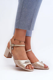 Woman wearing Avenari Soft Suede Embellished Sandals with post heels, featuring velvety eco-suede and minimal embellishments.