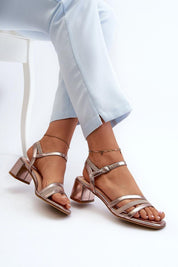 Woman wearing Sylviane Triple Strap Heel Sandals with block heel and adjustable ankle strap, featuring eco leather finish.