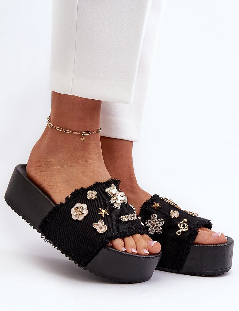 Toriva Foam Platform Badge Slides with whimsical badges, lightweight design, and 1.77-inch platform, offering casual height and comfort.