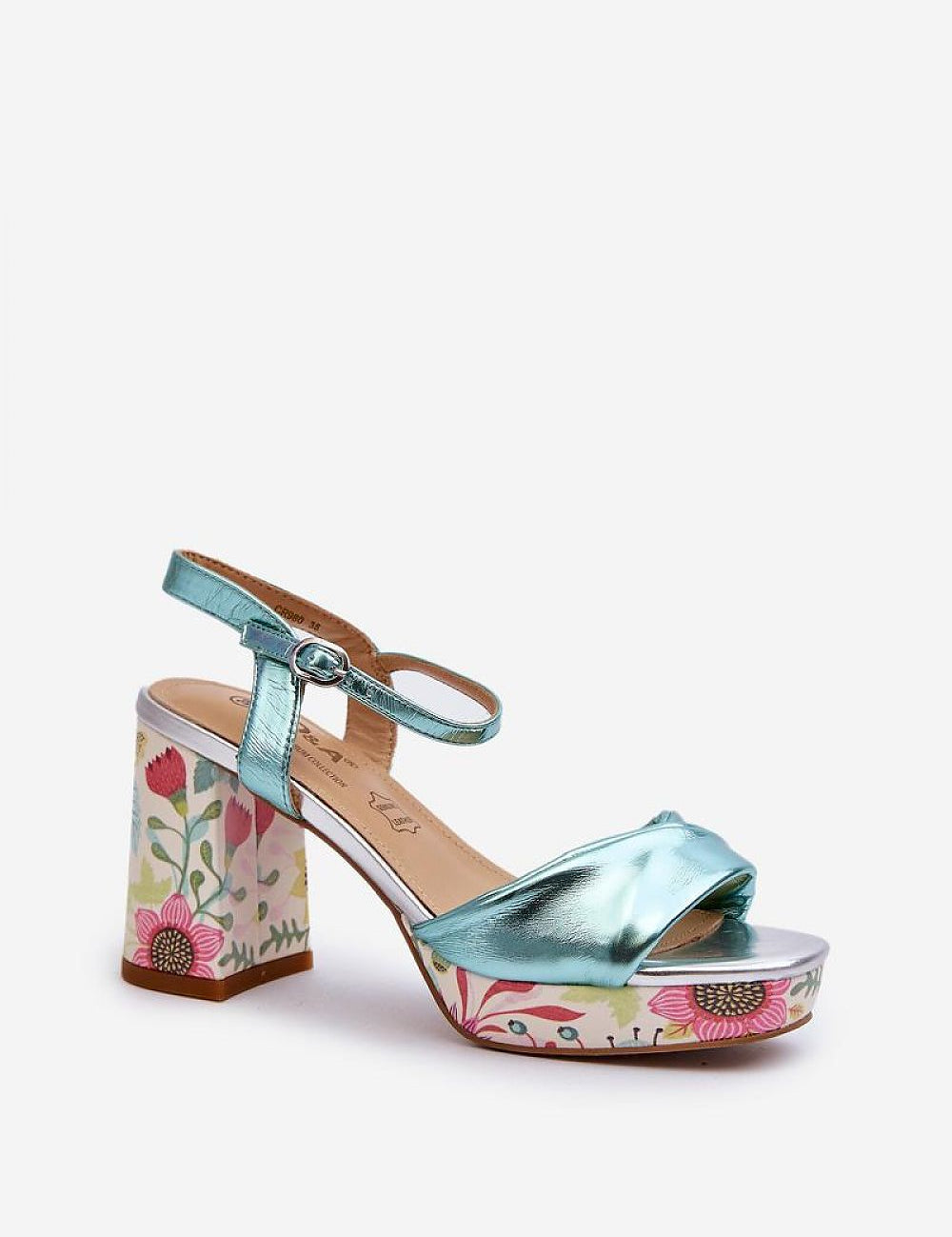 Florvella patterned block heel sandal in metallic blue with floral design, featuring buckle strap and artificial leather upper.