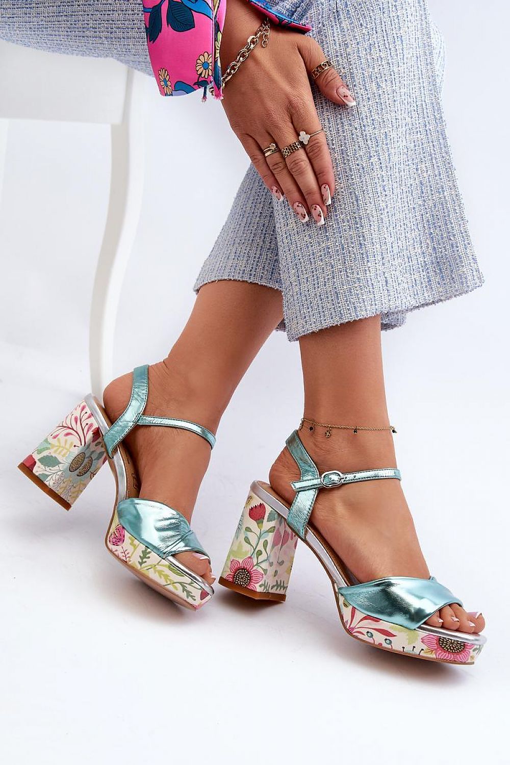 Florvella Patterned Block Heel Sandals with floral design, artificial leather upper, block heel, adjustable buckle strap, shown on model.
