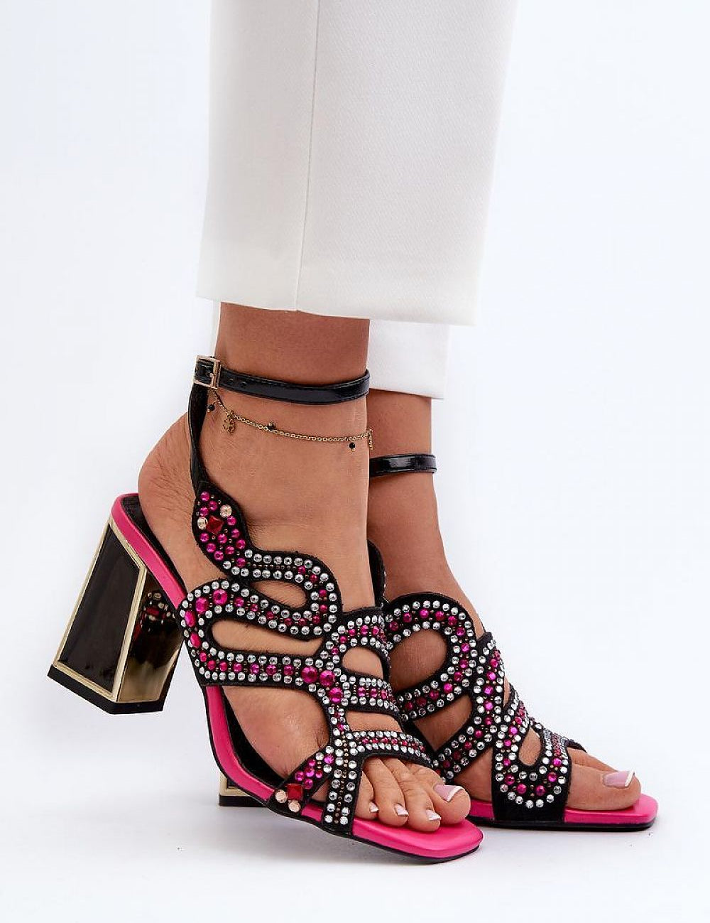 Elianta Crystal Block Heel Sandals with suede-like upper and embellishments, showcasing sculptural elegance and high block heel design.