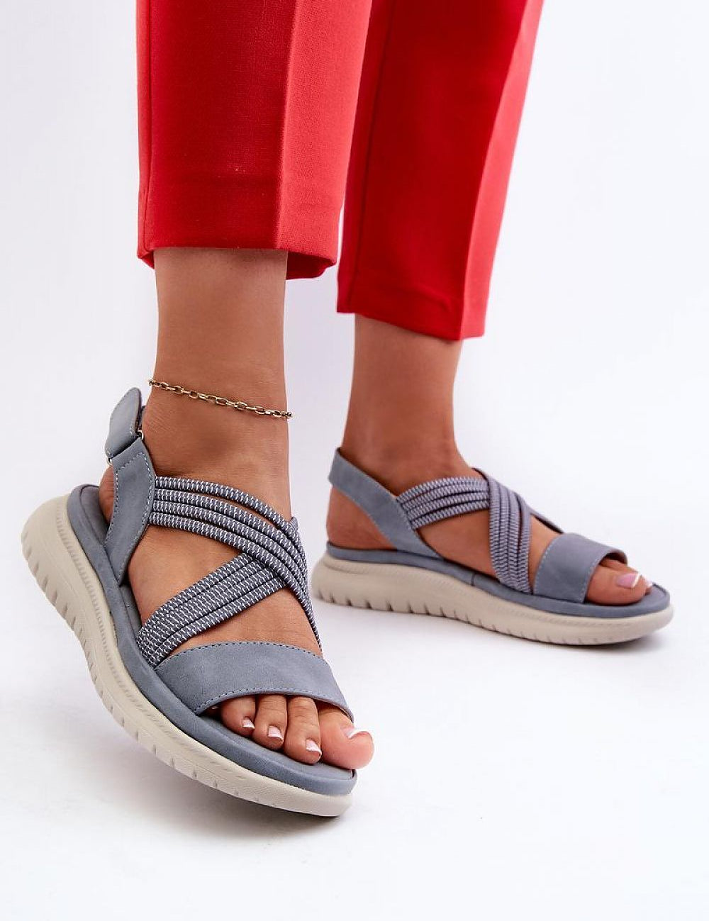 Eravelle Motion Grip Sandals with eco leather uppers and Velcro straps, worn with red pants. Perfect for active days and outdoor walks.