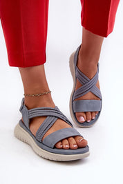 Person wearing Eravelle Motion Grip Sandals in gray with eco leather and Velcro straps, perfect for active days and outdoor walks.