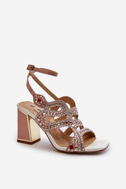 Elianta Crystal Block Heel Sandals with embellishments, suede-like upper, and adjustable strap for elegant and confident style.