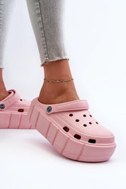 Pink Rivaya Sculpted Foam Slides with platform sole, featuring lightweight foam construction for cushioned, stable steps.