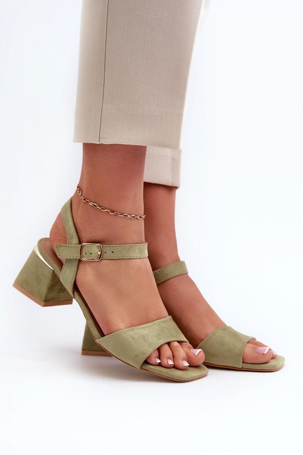 Woman wearing Valenta eco suede block-heel sandals with ankle strap, perfect for stylish summer outfits.