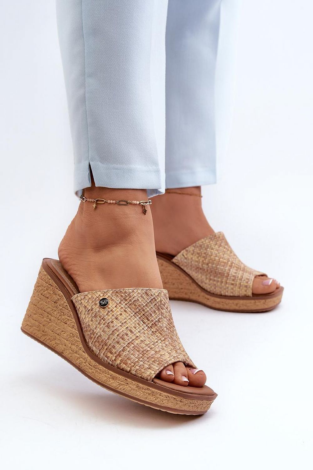Woman wearing Ardeva Braided Wedge Flip-Flops with synthetic upper and leather footbed, showcasing braided platform and stylish summer look.