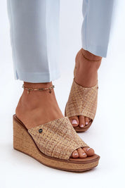 Woman wearing Ardeva Braided Wedge Flip-Flops with synthetic braided platform for casual summer style and comfort.