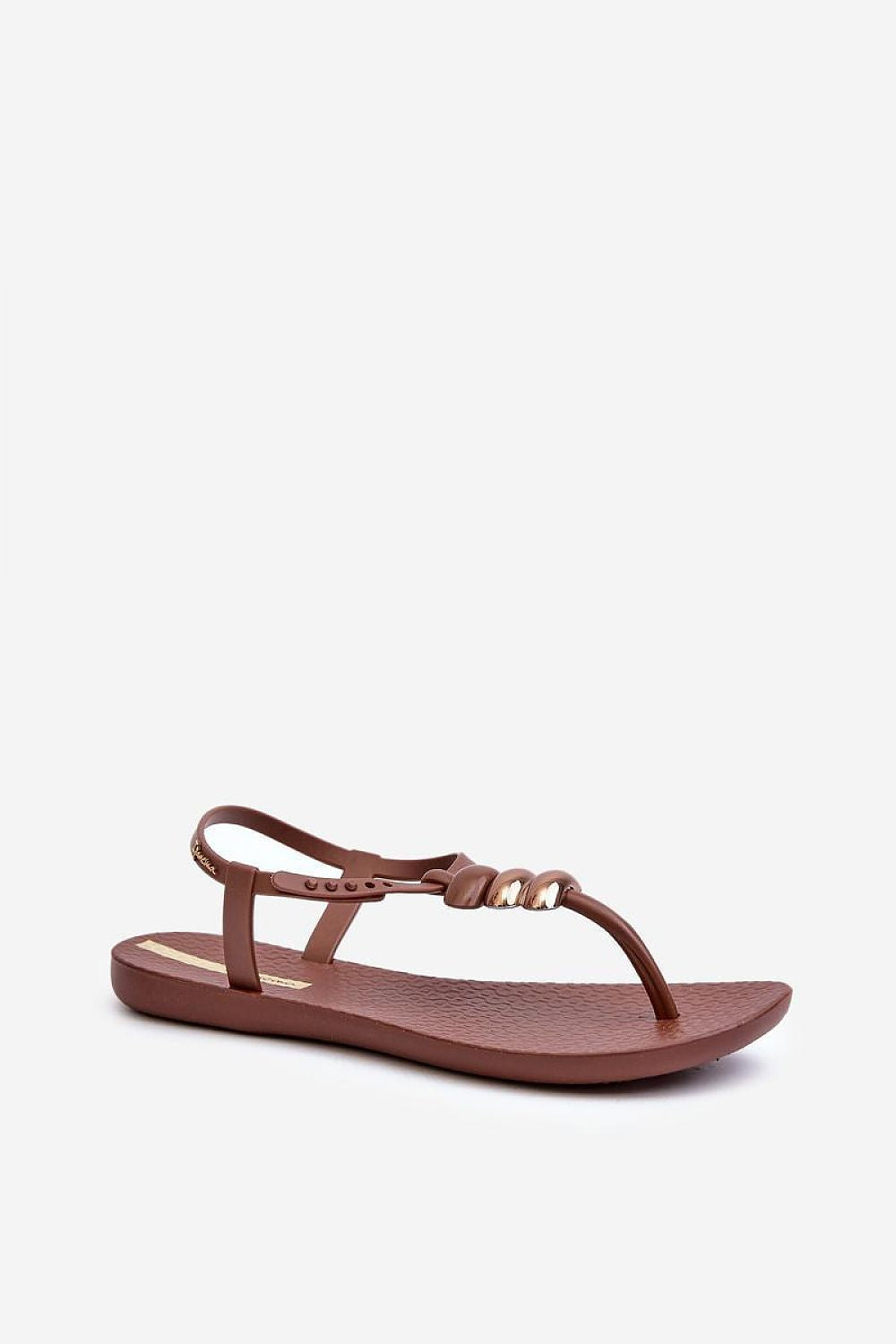 Women's Sorela buckle-strap rubber sandals in brown with sleek minimalist design, dual-buckle closure, flexible flat sole for comfort.
