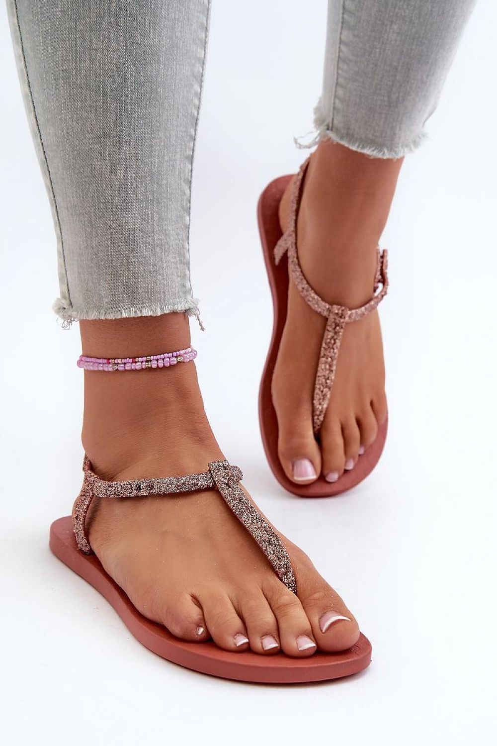 Shimmering Zirelli Buckled Shine Sandals with sequin detailing and adjustable strap, perfect for summer style and comfort.
