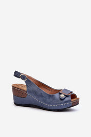 Vesmira Lifted Comfort Wedges in blue eco leather with adjustable buckle, cushioned suede insole, sculpted silhouette, and soft-touch finish.